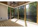 Screened-in porch with wood ceiling, ceiling fan, and views of the backyard at 3923 Cedar Knolls Dr # 12, Youngsville, NC 27596