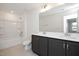 Bright bathroom featuring double sink vanity, tile floors, bathtub, and shower at 3935 Willow Gate Way, Knightdale, NC 27604