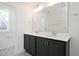 Elegant bathroom with a double vanity, modern mirrors, and stylish lighting fixtures at 3935 Willow Gate Way, Knightdale, NC 27604