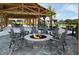 Outdoor fire pit area featuring a stone fire pit and comfortable seating at 3935 Willow Gate Way, Knightdale, NC 27604