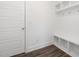 Convenient mudroom with built-in storage, bench seating, and hooks for organizing belongings near the entrance at 3935 Willow Gate Way, Knightdale, NC 27604