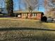 Brick ranch house with carport and yard at 404 W Ninth St, Siler City, NC 27344