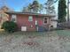 Rear view of brick house with HVAC unit at 404 W Ninth St, Siler City, NC 27344