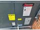 Amana HVAC unit with EnergyGuide label at 404 W Ninth St, Siler City, NC 27344