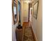 Hallway with hardwood floors and artwork at 404 W Ninth St, Siler City, NC 27344