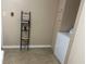Laundry room with washer and shelving unit at 404 W Ninth St, Siler City, NC 27344