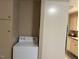 Laundry room with washer and built-in cabinets at 404 W Ninth St, Siler City, NC 27344