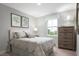 Cozy bedroom with a double bed and a dresser at 436 Autumn Moon Dr, Zebulon, NC 27597