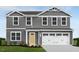 Two-story house with gray siding, white trim, and a two-car garage at 436 Autumn Moon Dr, Zebulon, NC 27597