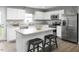 Modern kitchen with white cabinets, stainless steel appliances, and an island at 436 Autumn Moon Dr, Zebulon, NC 27597