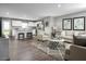 Open living space with hardwood floors, a comfortable couch, and a kitchen island at 436 Autumn Moon Dr, Zebulon, NC 27597