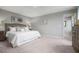 Spacious main bedroom with plush carpeting and an en-suite bathroom at 436 Autumn Moon Dr, Zebulon, NC 27597