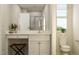 Bathroom with white cabinets, marble countertops, a toilet and a shower at 5302 River Reach Dr, Raleigh, NC 27616