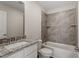 Bathroom with white cabinets, marble countertops, a toilet and a shower/bathtub at 5302 River Reach Dr, Raleigh, NC 27616