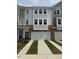 Charming townhome with a two-car garage and beautiful curb appeal at 5302 River Reach Dr, Raleigh, NC 27616
