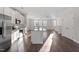 Modern kitchen featuring stainless steel appliances, granite countertops, and an open floor plan at 5302 River Reach Dr, Raleigh, NC 27616