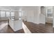 Modern kitchen with sleek white cabinets, stainless steel appliances, and a spacious island with bar seating at 5302 River Reach Dr, Raleigh, NC 27616