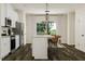 Bright kitchen featuring a modern island with bar seating and ample counter space, great for meal prep at 5302 River Reach Dr, Raleigh, NC 27616