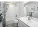 Clean bathroom with white vanity, shower/tub combo, and patterned curtain at 600 Mohinda Way, Willow Springs, NC 27592