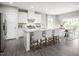 Spacious kitchen with white cabinets, granite island, and stainless steel appliances at 600 Mohinda Way, Willow Springs, NC 27592