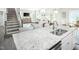 Kitchen island with granite countertop and double sink at 600 Mohinda Way, Willow Springs, NC 27592