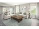 Relaxing living room featuring a sectional sofa and large windows at 600 Mohinda Way, Willow Springs, NC 27592