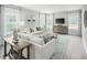 Spacious living room with sectional sofa and large windows at 600 Mohinda Way, Willow Springs, NC 27592
