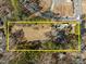 Aerial view of property showing large lot and surrounding area at 6516 Battle Bridge Rd, Raleigh, NC 27610