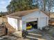 Detached two-car garage with one car visible inside at 6516 Battle Bridge Rd, Raleigh, NC 27610