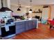 Open concept kitchen with island and stainless steel appliances at 6516 Battle Bridge Rd, Raleigh, NC 27610