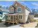 Exterior shot features a screened in porch, siding, windows and a small wooden porch at 713 Heidelberg St, Durham, NC 27704