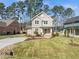 Beautiful two-story home with a manicured lawn, traditional architecture, and an inviting front porch at 713 Heidelberg St, Durham, NC 27704