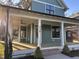 Beautiful home featuring a spacious, covered front porch perfect for relaxing at 715 Heidelberg St, Durham, NC 27704