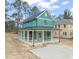 Craftsman style home with covered porch and teal siding at 715 Heidelberg St, Durham, NC 27704
