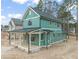 Teal home featuring a covered back porch at 715 Heidelberg St, Durham, NC 27704