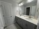 Bathroom featuring a double sink vanity with gray cabinetry and tile flooring at 752 Portland Rose Dr, Knightdale, NC 27545