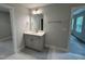 Bathroom featuring a single sink vanity with gray cabinetry and tile flooring at 752 Portland Rose Dr, Knightdale, NC 27545