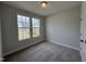 Cozy bedroom with plush carpet, natural light from double windows at 752 Portland Rose Dr, Knightdale, NC 27545