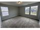 Bedroom with two windows, neutral carpet and light-colored walls at 752 Portland Rose Dr, Knightdale, NC 27545