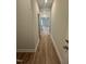 Hallway featuring wood floors and views into the living spaces at 752 Portland Rose Dr, Knightdale, NC 27545