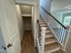 Hallway featuring storage area and stairway with wood and metal railings at 752 Portland Rose Dr, Knightdale, NC 27545
