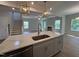 Gourmet kitchen island with quartz countertop and stainless steel sink at 752 Portland Rose Dr, Knightdale, NC 27545