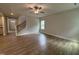 Inviting living room featuring hardwood floors, a stairway, and an open floor plan at 752 Portland Rose Dr, Knightdale, NC 27545