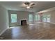 Open-concept living room with hardwood flooring, fireplace and ample natural light at 752 Portland Rose Dr, Knightdale, NC 27545