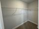 Walk-in closet with built-in shelving and carpeted flooring at 752 Portland Rose Dr, Knightdale, NC 27545