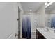 Bathroom with double vanity and tub shower at 810 Brake St, Nashville, NC 27856