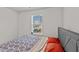 Bedroom with a gray upholstered bed and patterned bedding at 810 Brake St, Nashville, NC 27856