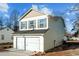 View of the side of the house, showcasing the garage and siding at 810 Brake St, Nashville, NC 27856