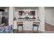 Kitchen features granite countertops and dark brown cabinets at 810 Brake St, Nashville, NC 27856