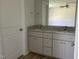 Double vanity bathroom with granite countertops at 83 Harvest Hills Ln, Dunn, NC 28334